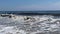 Large waves forming and breaking on the shore of Fire Island New York