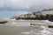 Large waves from the Irish Sea during a winter storm batter the harbor wall at the long Hole in Bangor Ireland