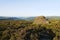 Large weathered gritstone rock stands on Surprise View