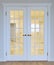 Large white glazed interior doors with classic brass handles