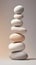 Large white pebbles stacked on top of each other, in the style of monochromatic palette