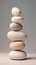 Large white pebbles stacked on top of each other, in the style of monochromatic palette