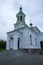 A large white stone church with a golden dome and a bell in eastern Europe is a Christian orthodox for the prayers of God