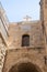 Large  white stone cross on the roof of the building on the Greek Patriarchate Street in Christian quarters in the old city of