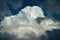 Large white storm cloud illuminated by the bright sun