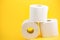 A large white toilet paper roll for use in bathrooms or kitchens, used for cleaning dirt in the bathroom background