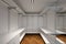 Large white walk-in closet with parquet