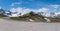 Large wide panorama of mountain pass Fuscher Torl, view point on Grossglockner High Alpine Road, Austria. Sunny summer day, snowy