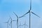 Large wind turbines moving to create kinetic energy for renewable energy supply