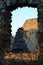 Large window in ruins of medieval Hrusov castle, central Slovakia, with view on other walls and windows of this landmark.