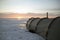 A large winter tent with a stove stands on the frozen snow-covered Lake Baikal. Winter hike