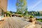 Large wood deck with lake and spring landscape.