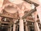 Large wooden ceiling beams, planks, ceilings under the ceiling with arches and lamps, lanterns in the Arab Islamic Mosque, a templ