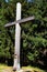 Large wooden cross placed near tourist path on crest of Javorniky mountains, boundary between Czech Republic and Slovakia