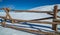 Large Wooden Fence on Snow Covered Mountain