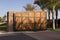 Large wooden gate to luxury home golf community