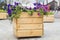 Large wooden pot with flower in outdoor. Large wooden pot with flowers