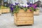 Large wooden pot with flower in outdoor. Large wooden pot with flowers