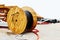 Large wooden reel with industrial power cable. Construction of power lines. Close-up. Copy space