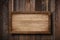 Large wooden sign hanging on ropes with wood planks background