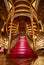 Large wooden staircase with red steps inside library bookstore Livraria Lello in historic center of Porto, famous for Harry Potter