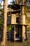 Large wooden tree house with climbing path