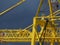 Large yellow crane in a shipyard. Cloudy sky