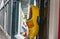 Large yellow dutch clog hanging on a doorway