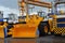 A large yellow excavator bucket. Construction machinery for sand transport