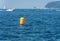 Large yellow inflatable signal buoy in the sea