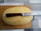 Large yellow melon with a beautiful knife on the table