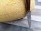 Large yellow melon with a beautiful knife on the table
