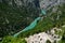 The largest European canyon Verdon Gorges with the view on the bridge and boats, pedalos on azure blue water , overlooking lake Sa