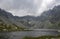 The largest mountain lake on slovakian side of High Tatras, Hincovo pleso surrounded by rocky mountains