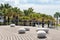 Larnaca embankment, Cyprus in spring. View of Larnaca seafront with palm trees and stone shaped benches, park zone near the beach