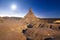 Las bardenas reales desertic landscape at night, moon shine over the horizon.