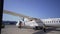 Las Palmas de Gran Canaria, SPAIN - April, 22, 2019 - The plane after landing, the airport staff works with a propeller