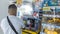 Las Pinas, Metro Manila, Philippines - A man buys an energy drink at an Uncle John\\\'s convenience store inside BF