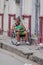 LAS TUNAS, CUBA - JAN 27, 2016: Old woman sits on a street in Las Tunas