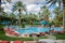 Las Vegas, Nevada - Outdoor tropical pool area at the JW Marriott hotel and resort, with poolside lounge chairs ,