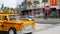 LAS VEGAS, NEVADA USA - 7 MAR 2020: Yellow vacant mini taxi cab close up on Harmon avenue corner. Small retro car model