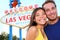 Las Vegas tourist couple at Las Vegas sign