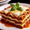 Lasagna, Italian main entre. Three layers of goodness with a sprig of Bay leaf