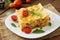 Lasagna with minced meat, green peas