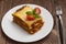 Lasagna, traditional Italian food on a wooden background