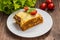 Lasagna, traditional Italian food on a wooden background