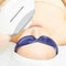 Laser facial hair removal. Cosmetology ipl device. Woman body in clinic. Medical beauty girl. Acne salon treatment tool