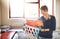 This is the last bunch of washing. a cheerful young woman sorting out a freshly washed pile of clothing at home.