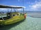 Last call from yellow boat for snorkel lovers to hurry up at Morere, Bahia State, Brazil