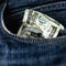 Last crumbled one hundred US Dollar in jeans pocket as symbol of poverty and bankruptcy. Not enough money concept